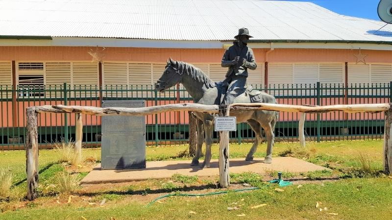 Darwin to Cairns road trip Statue of a drover on horseback with commemorative plaque at Camooweal