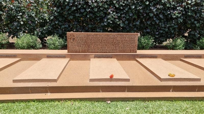 Darwin to Cairns road trip Memorial headstones and dedication plaque at Adelaide River War Cemetery honouring lives lost during the bombing of Darwin in World War II
