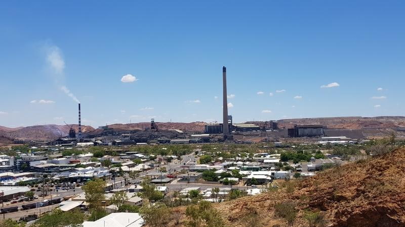 Darwin to Cairns road trip View over Mount Isa township with the iconic mining stack and smelter complex dominating the outback skyline in north-west Queensland