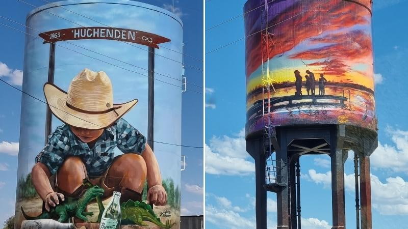 Darwin to Cairns road trip Painted water towers in Hughenden, Queensland, featuring murals of a child with dinosaurs and a family watching a sunset over an outback landscape