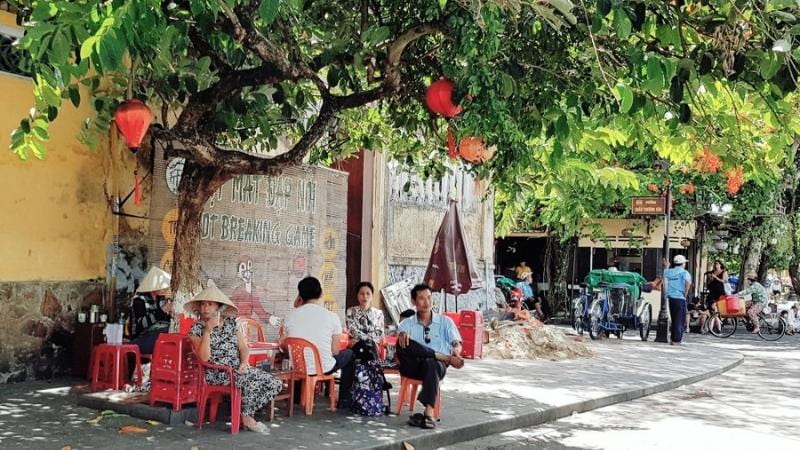 Locals relaxing on the streets of the Ancient Town Hoi An Vietnam