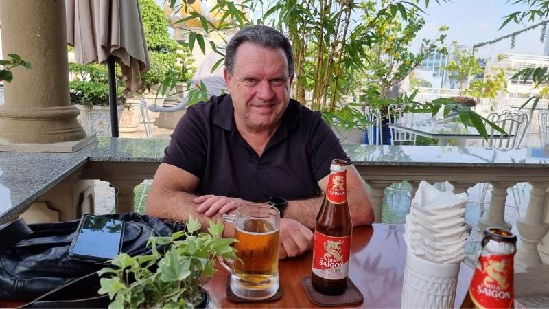 Alan enjoying a drink at the Rex Hotel Saigon