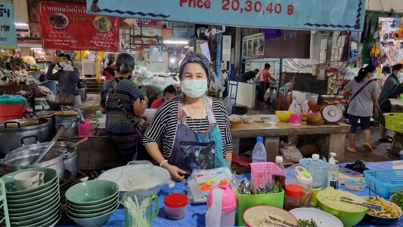 Lady preparing food at a Chiang Mai market