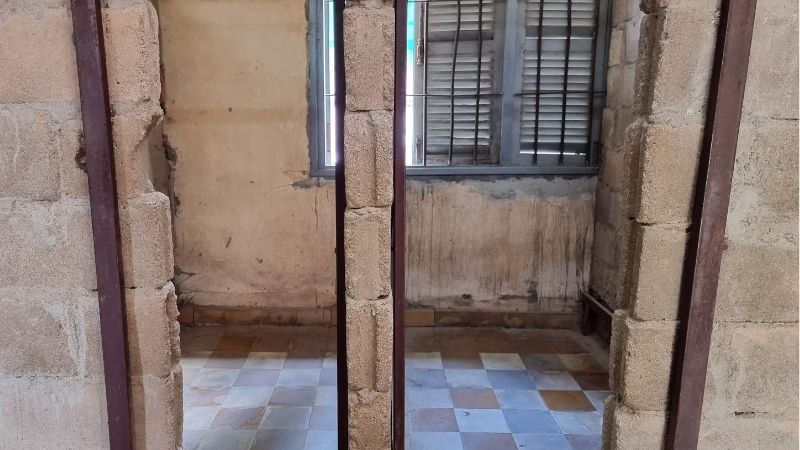 Phnom Penh Killing Fields tour The small prison cells inside S21 Prison Phnom Penh