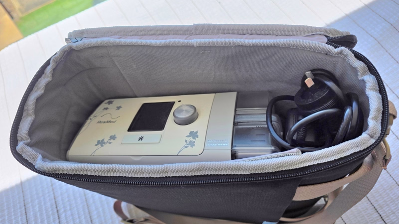 ResMed CPAP travel bags ResMed AirSense CPAP machine packed inside a Luxe travel carry bag with power cord coiled for use